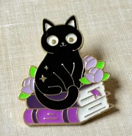 5. GATITO NEGRO LIBROS VIOLETA - PINES DAZZLE